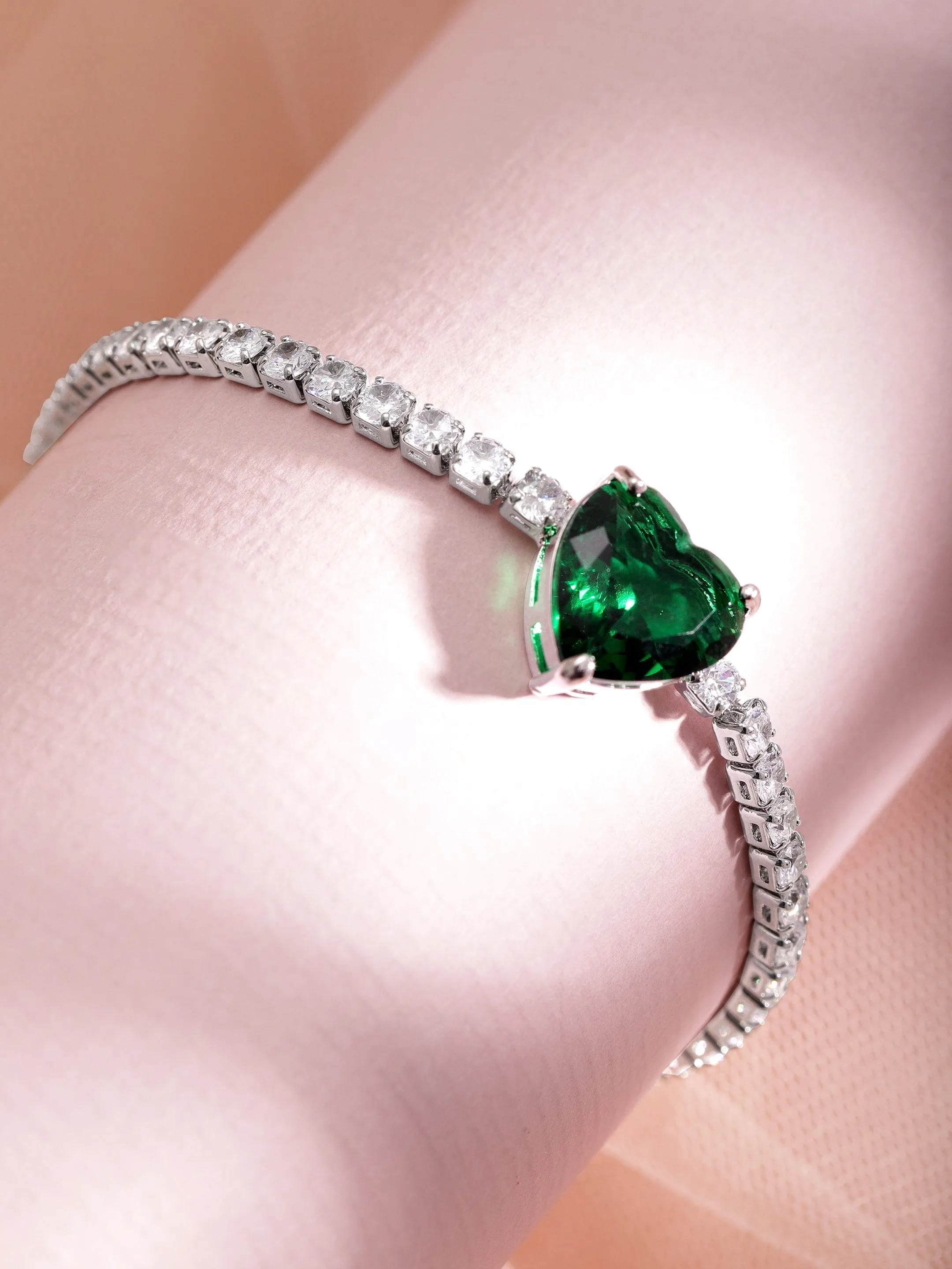 Rubans Voguish Rhodium Plated Emerald Studded Heart Shaped Zirconia Bracelet with Zirconia Accents